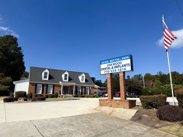 Oakwood Dental and Implants office exterior and sign at 4212 McEver Road, Oakwood, GA