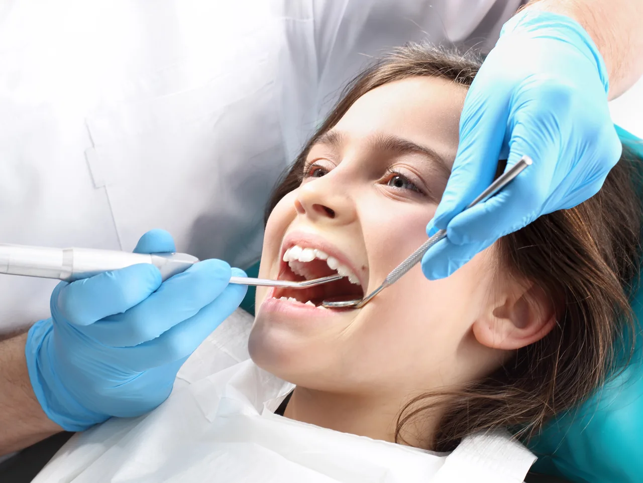 Child receiving a dental filling evaluation